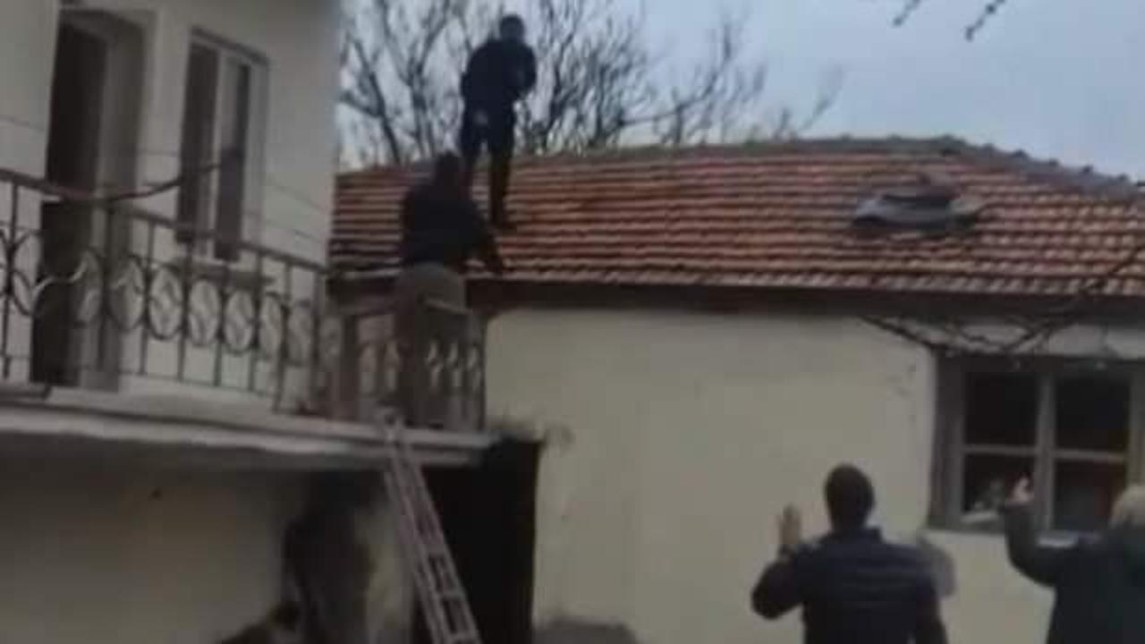 Çatıda kıstırılan aranan şahıs: 