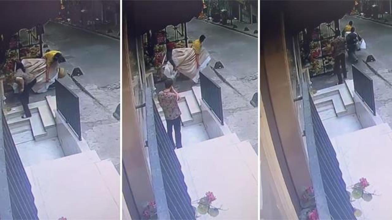 Hırsız çaldığı televizyonu taşımakta zorlanınca esnaf yardım etti