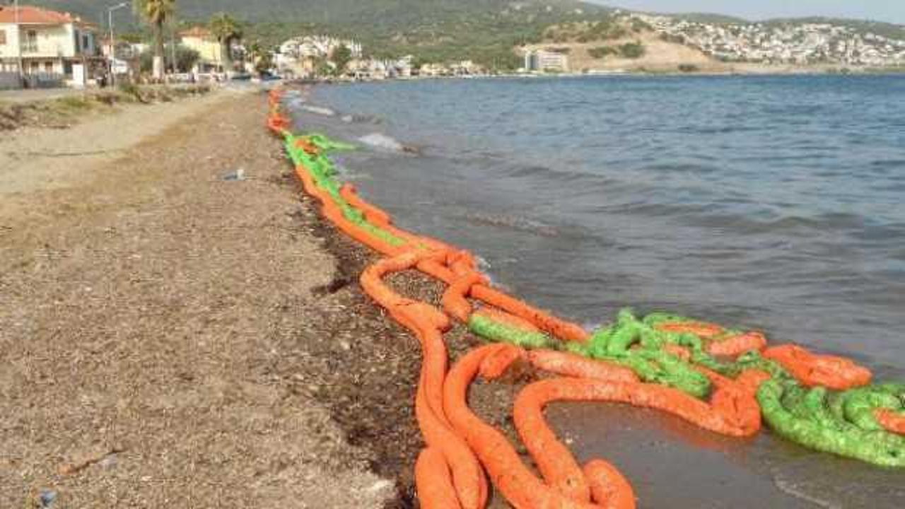 İzmir'de gemiden bırakılan atıklar sahile vurdu